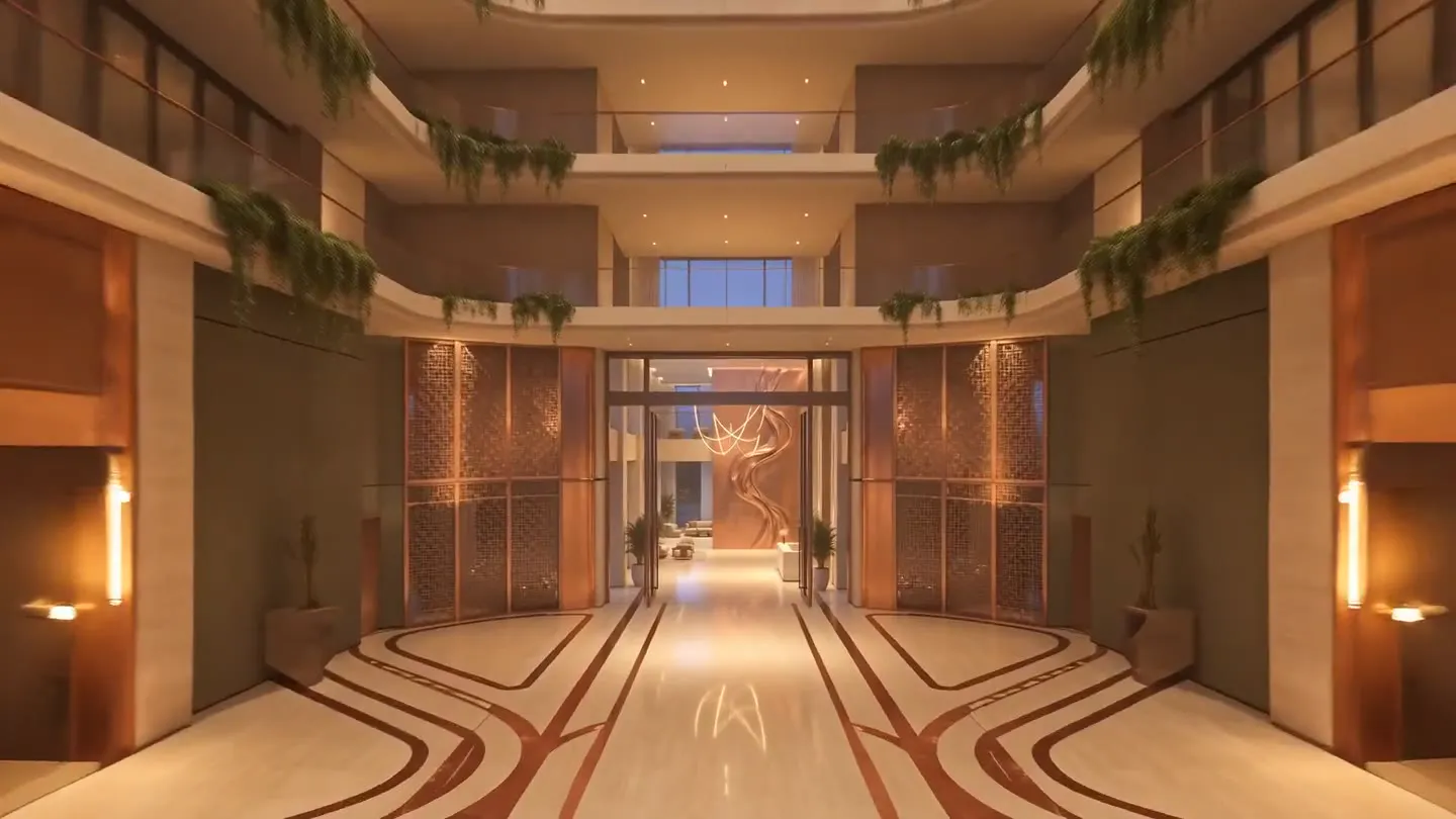 A warm-lit atrium corridor leading to the lobby